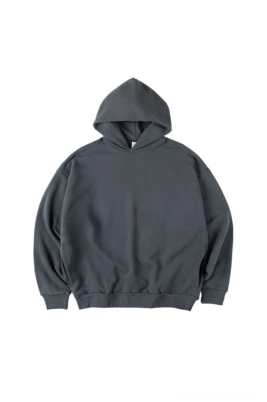 Dark slate gray oversized hoodie shown with the hood up and relaxed drop shoulder fit