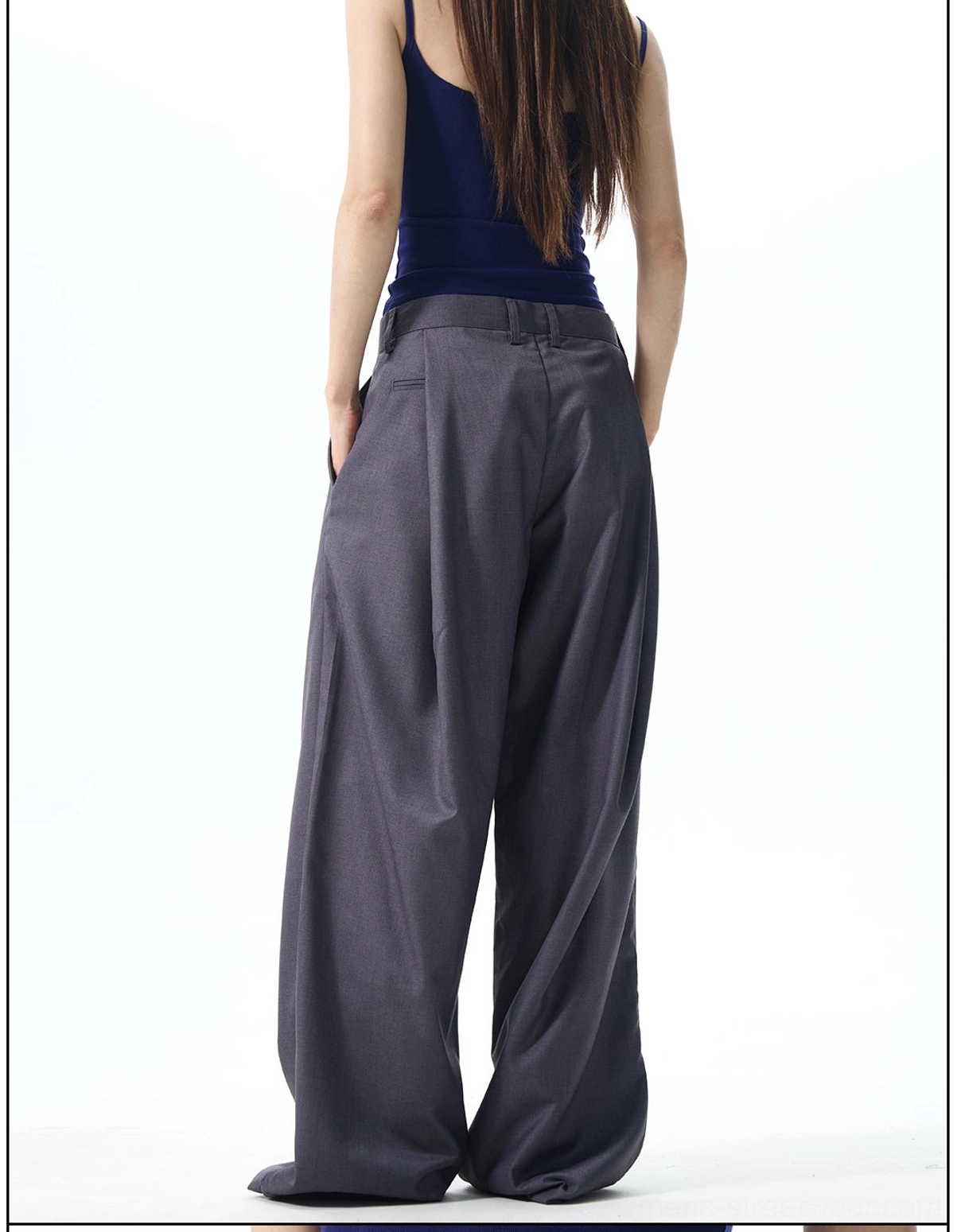Back view of dark slate grey relaxed wide leg dress pants with a clean tailored waistband