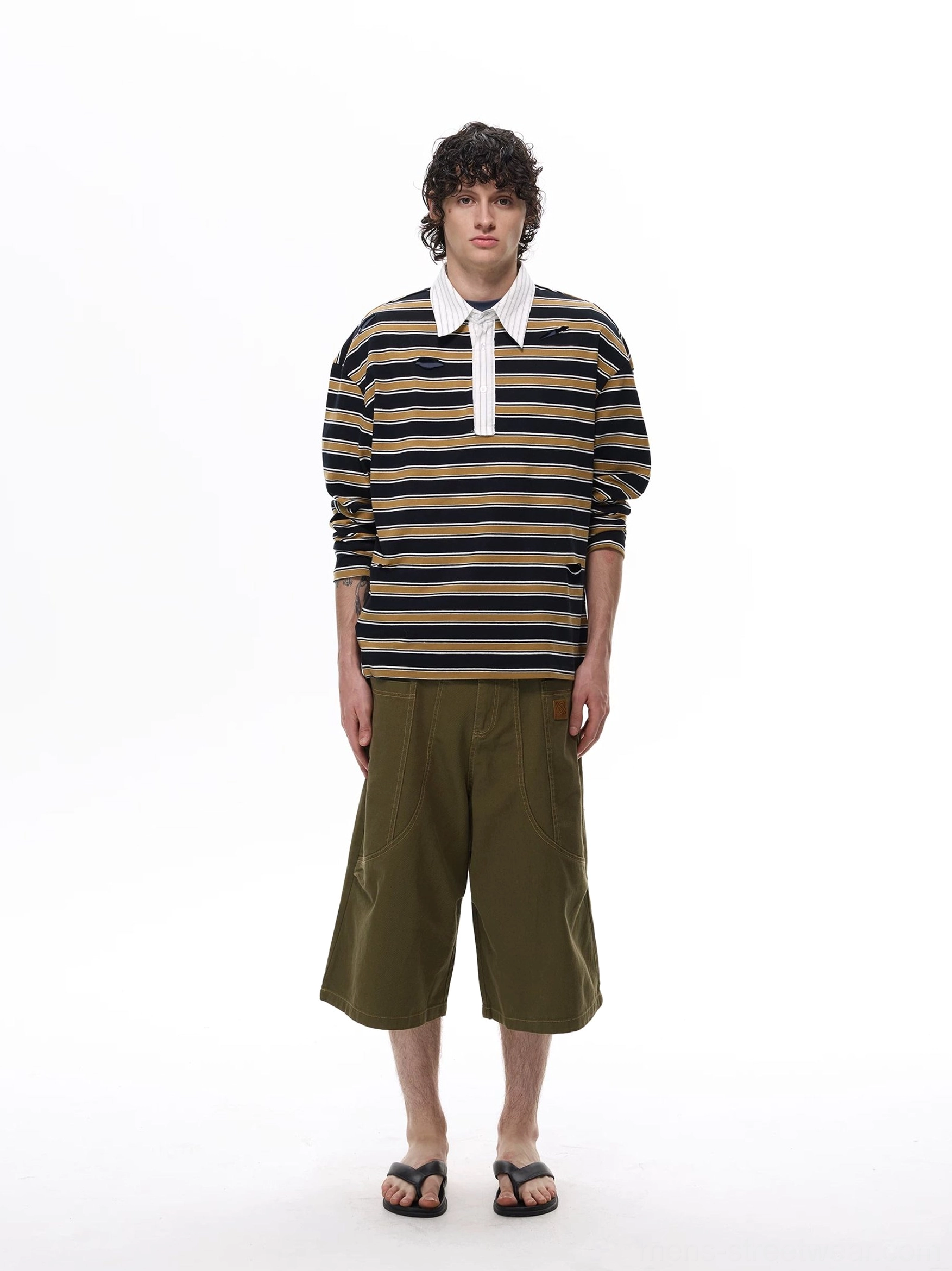 Dark-toned horizontal striped rugby polo shirt with pointed white collar and drop-shoulder oversized fit styled with cargo shorts