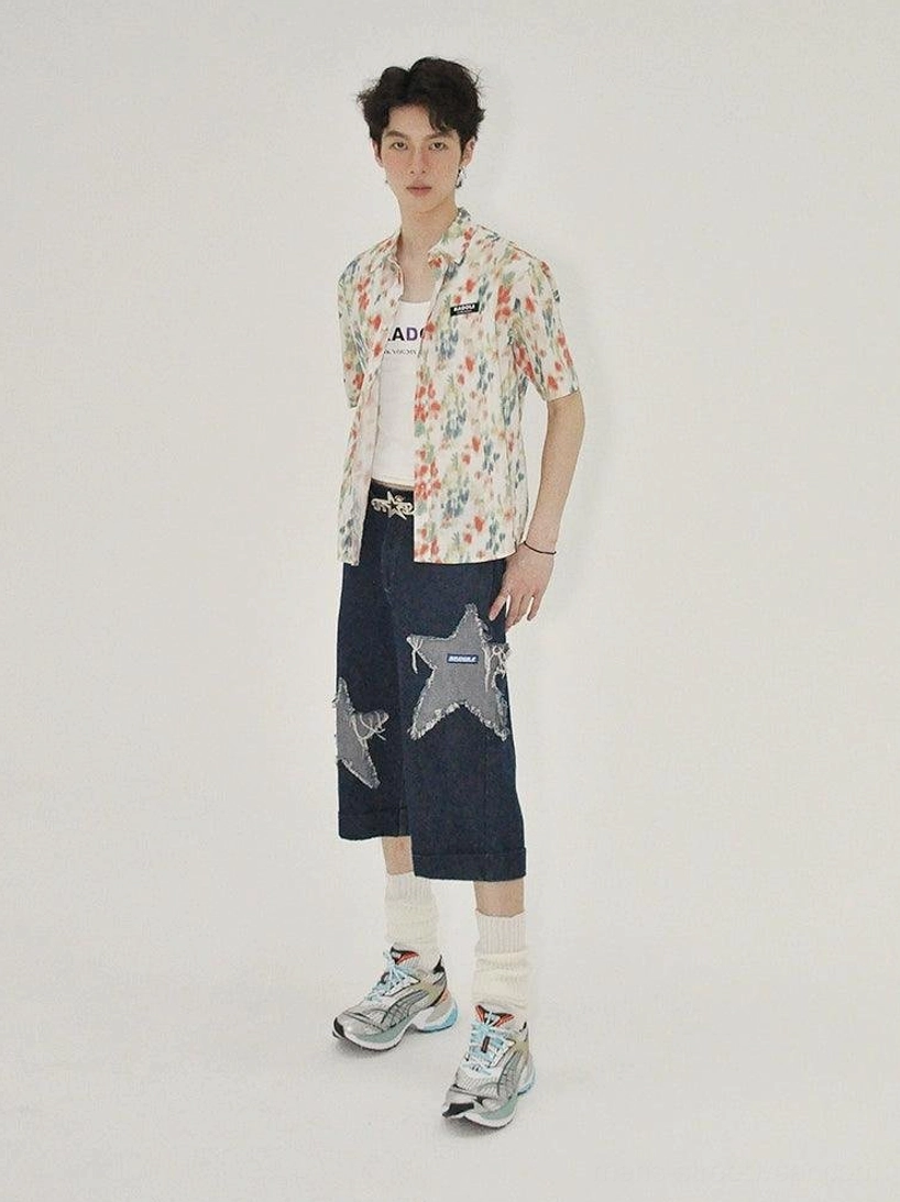 Dark wash denim culottes with grey star appliqués, cropped hem, and wide-leg proportions for Korean style streetwear wardrobes