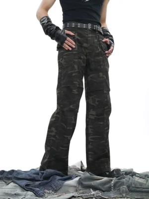 Dark woodland camouflage wide leg tactical cargo pants front three quarter view styled with goth streetwear outfit