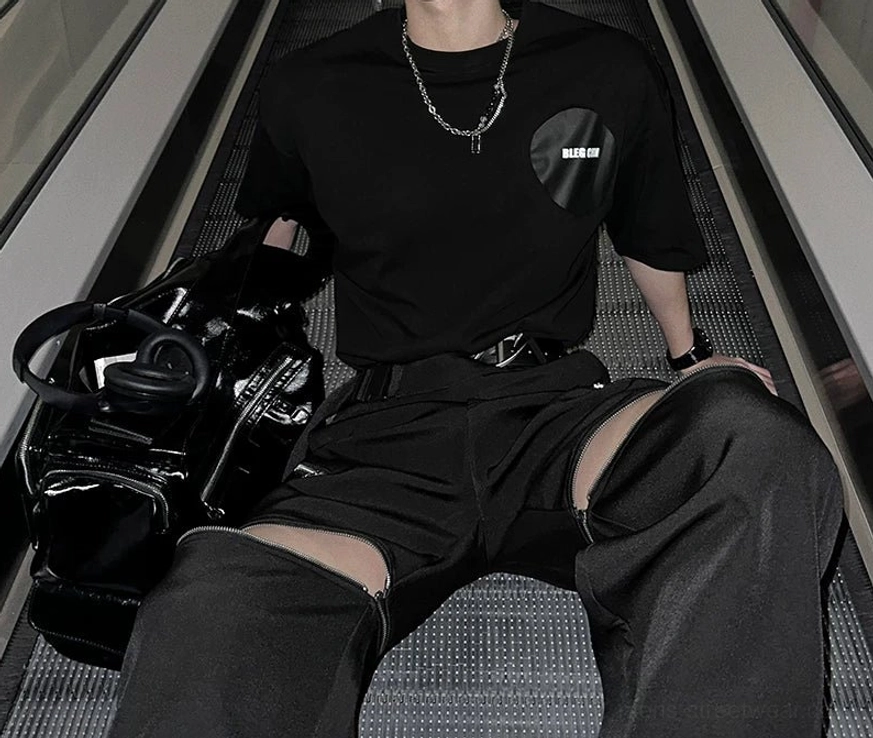 Oversized black graphic streetwear t-shirt with contrast back patch and relaxed boxy silhouette
