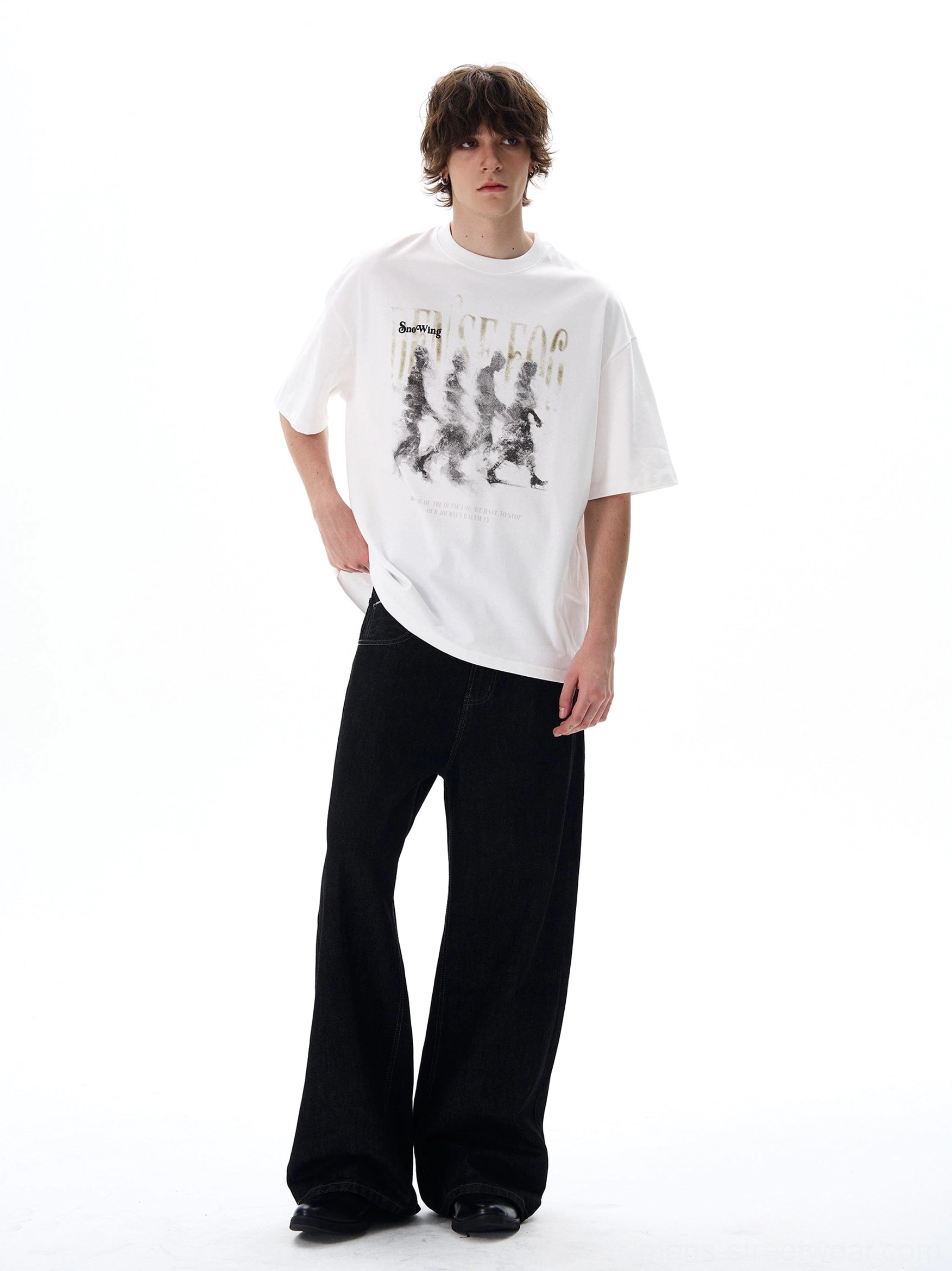 White Dense Fog vintage graphic oversized streetwear tee worn with black wide-leg trousers front view