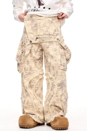 Desert camouflage distressed wide straight-leg cargo pants front three-quarter view with oversized utility pockets