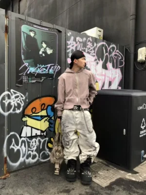 Desert wash music note star hem wide leg jeans worn by male model in urban graffiti street setting