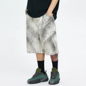 Side rear view of detachable leg moto cargo shorts with faded ash grey wash, wide cropped fit, ribbed knee panels, and cargo styling