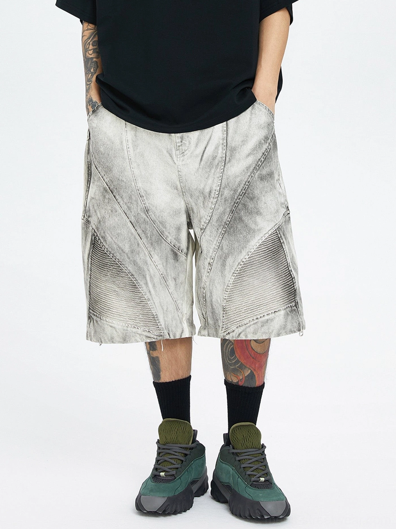 Rear view of detachable cargo bermuda shorts with wide short legs, visible rear cargo pockets, and stitched knee details