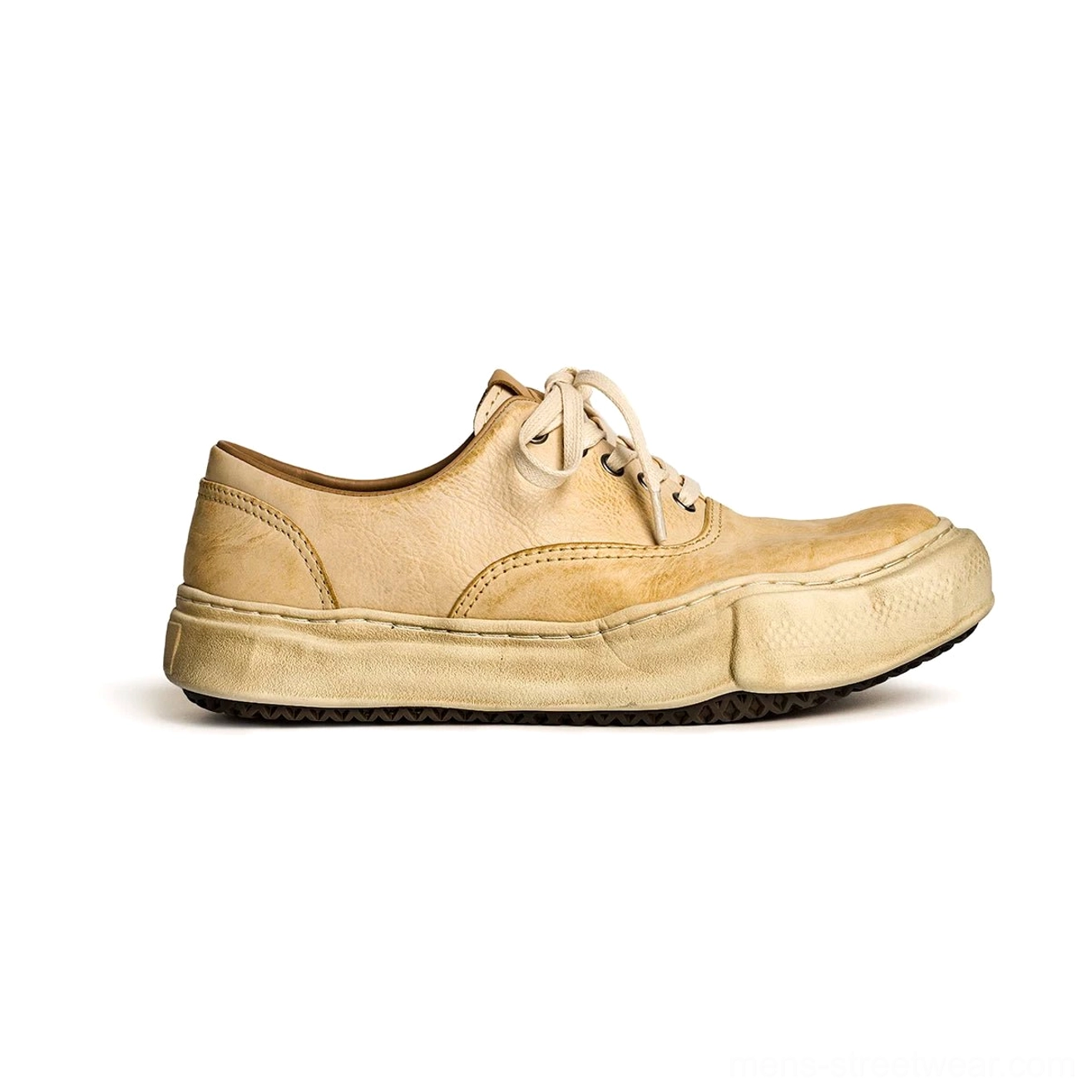 Distressed beige leather retro sneakers with tan washed uppers, beige laces, aged off-white thick soles, and vintage casual streetwear styling