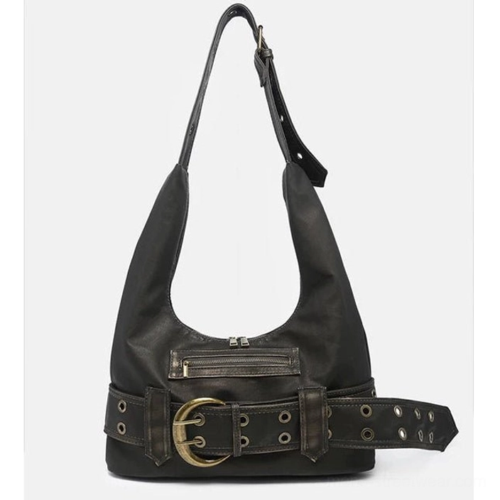 Close-up front view of distressed black buckle belt hobo bag with vintage faux leather texture, metal grommets, front zipper pocket, and round buckle