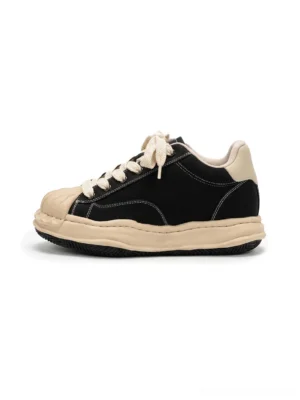 Black distressed shell-toe platform court sneakers with cream rubber toe cap and chunky 7 cm sculpted sole