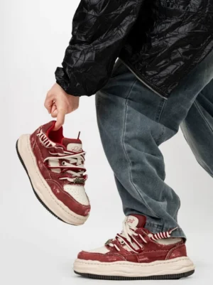 Red and white distressed platform skate sneakers with double laces and vintage weathered textile upper