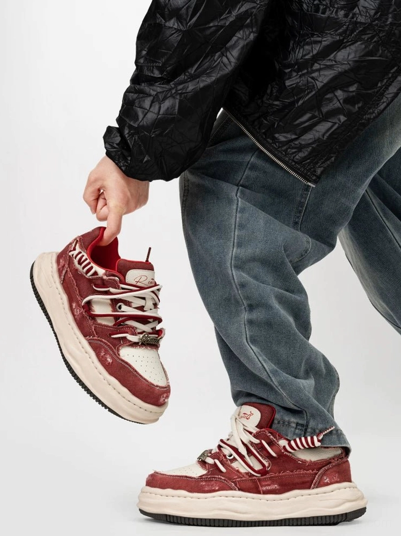 Red and white distressed platform skate sneakers with double laces and vintage weathered textile upper