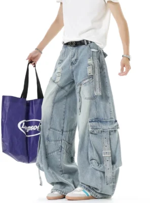 Light blue distressed cargo denim pants with wide baggy legs, adjustable strap pockets, ripped thigh details, and Y2K streetwear styling