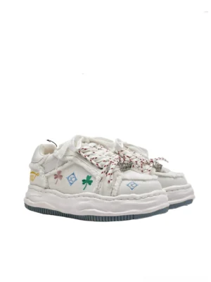White distressed embroidered platform sneakers with frayed canvas upper colorful clover and geometric embroidery and thick platform sole