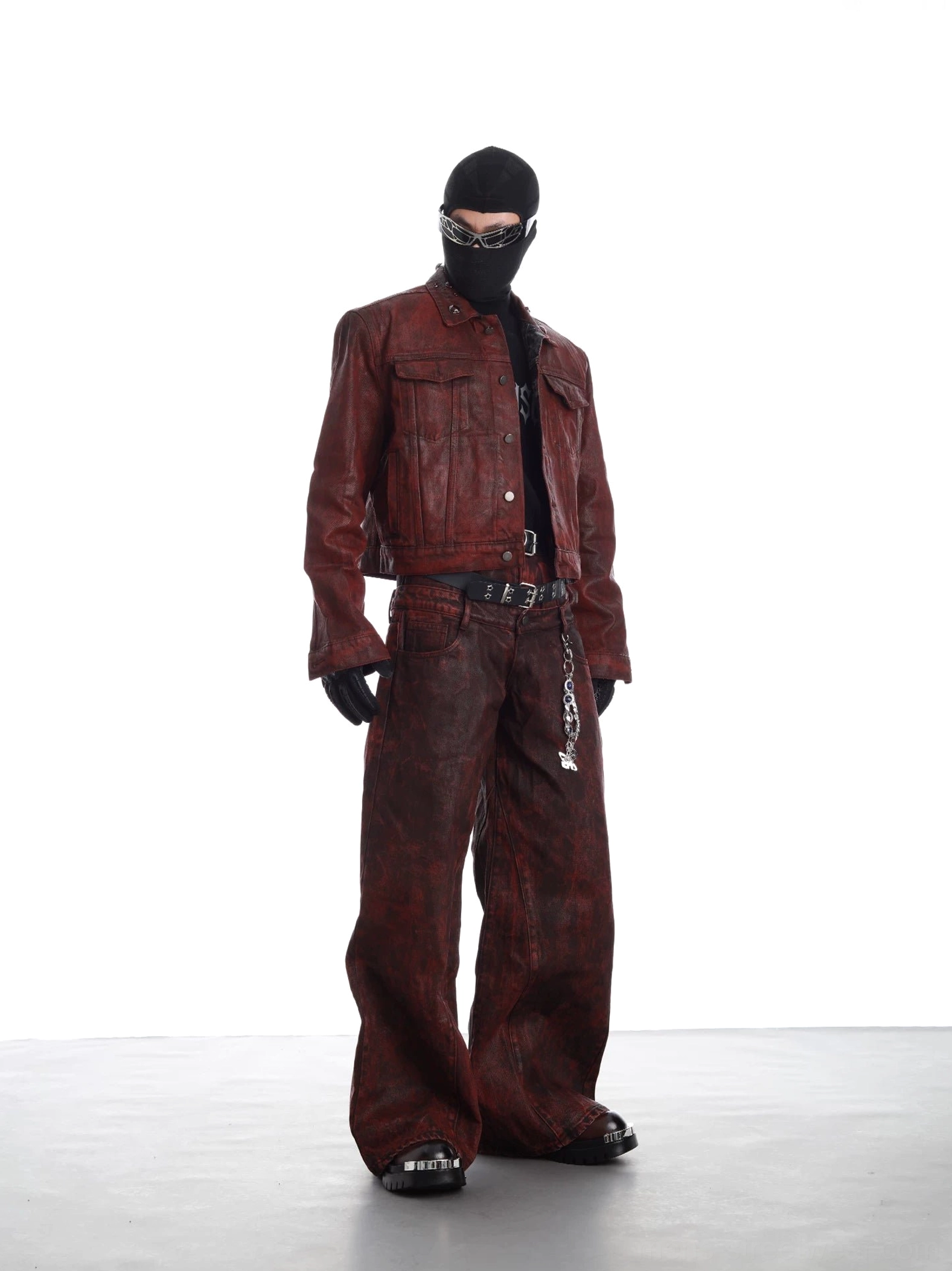 Burgundy distressed faux leather cropped trucker jacket styled with matching wide-leg trousers in a full-body streetwear outfit