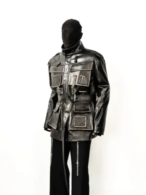 Distressed faux leather multi-pocket belted utility jacket front view styled with black striped trousers