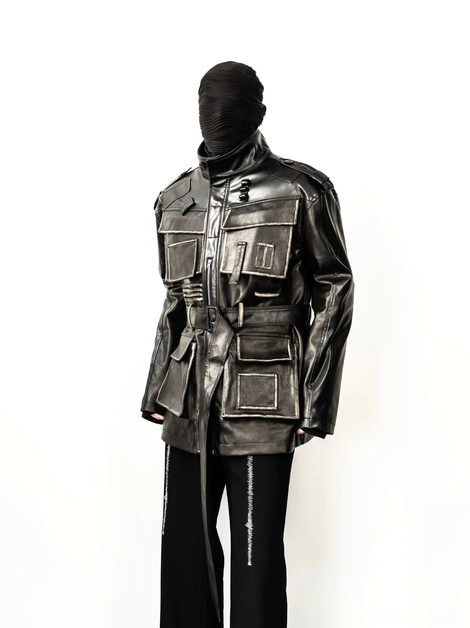 Distressed faux leather multi-pocket belted utility jacket front view styled with black striped trousers