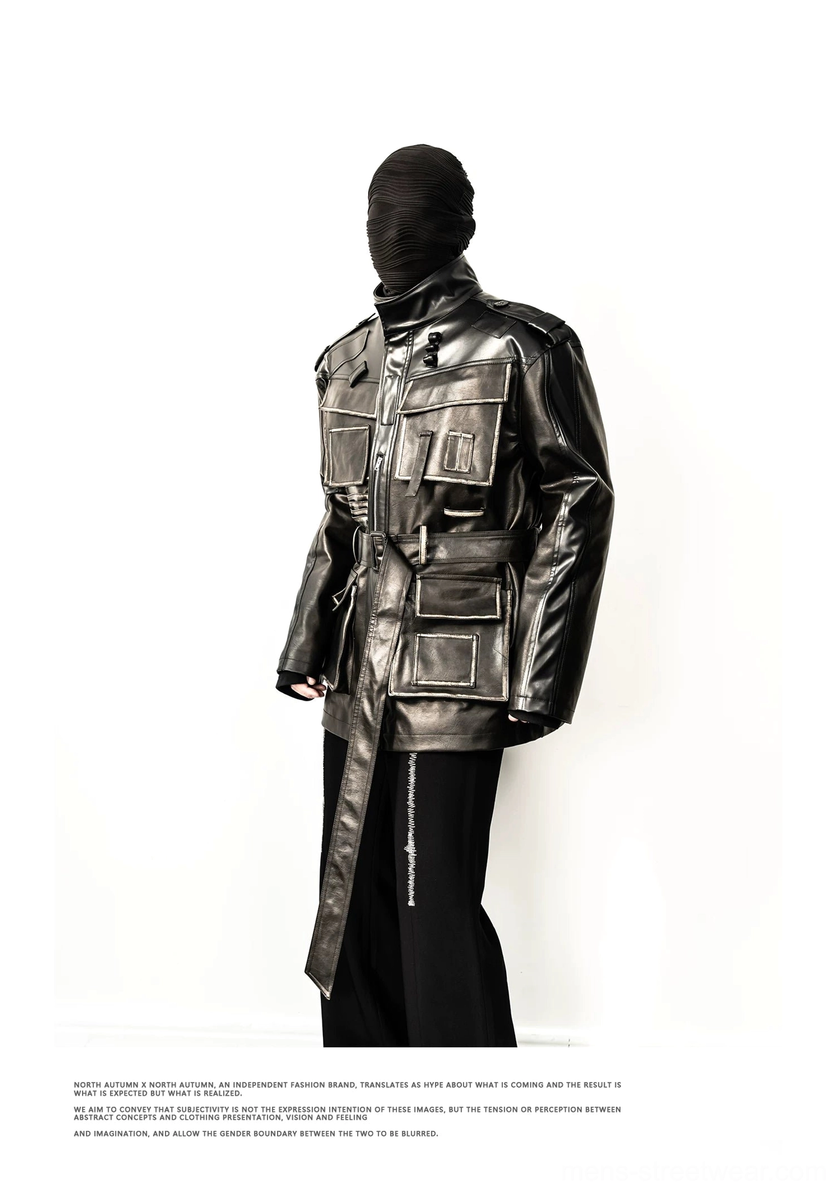 Distressed faux leather multi-pocket belted utility jacket worn in a relaxed longline streetwear outfit
