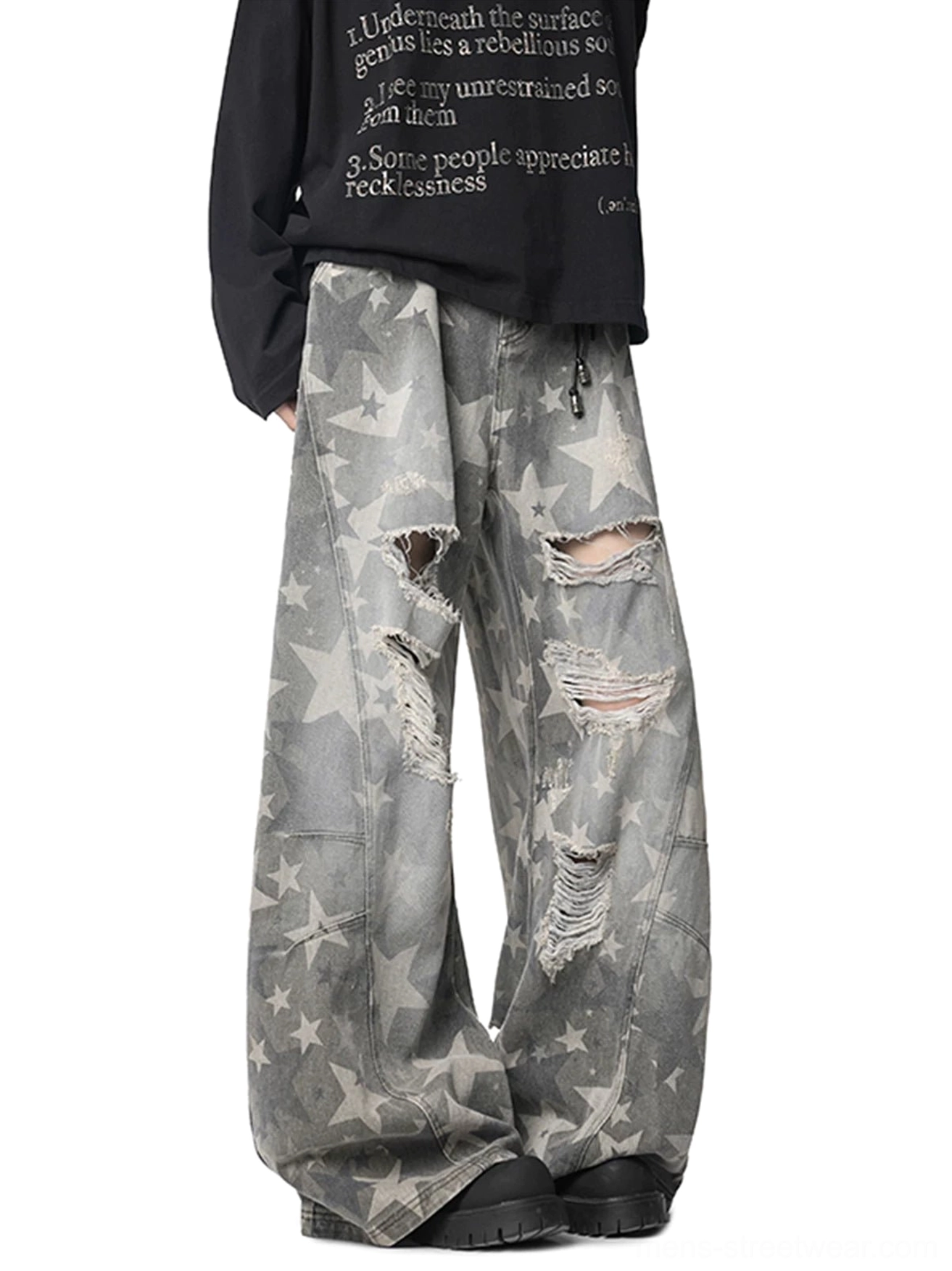 Distressed grey star print wide leg baggy jeans front three quarter view with ripped thigh and knee details