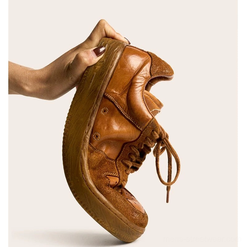 Distressed brown horsehide leather sneaker with matching aged rubber outsole displayed on white background