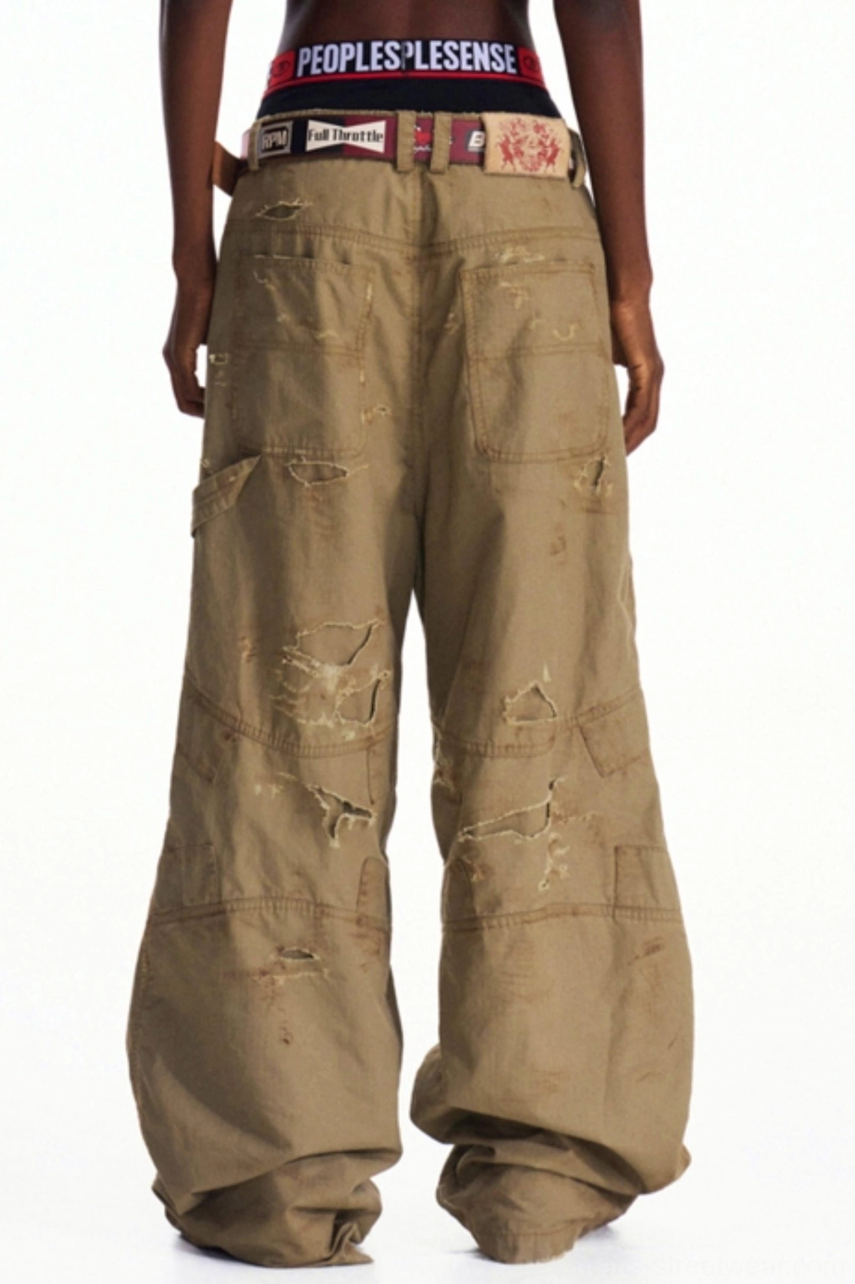 Rear view of distressed khaki wide-leg cargo pants with back patch pockets and relaxed oversized streetwear silhouette