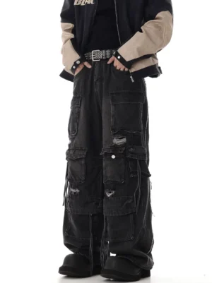 Black washed distressed wide-leg cargo jeans with oversized flap pockets and ripped details front outfit view