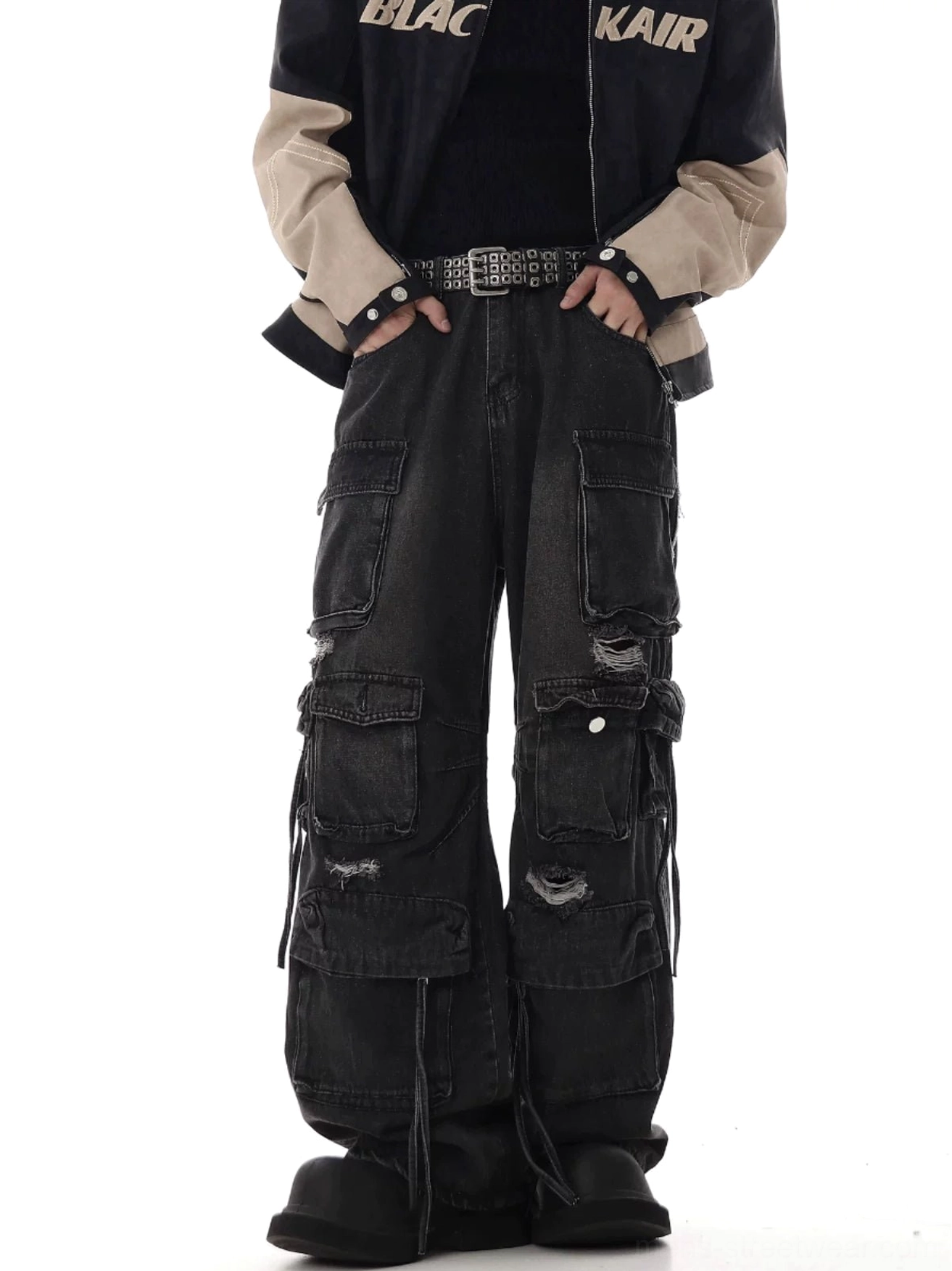 Black distressed cargo jeans close front view with multi-pocket utility design frayed rips and wide-leg fit