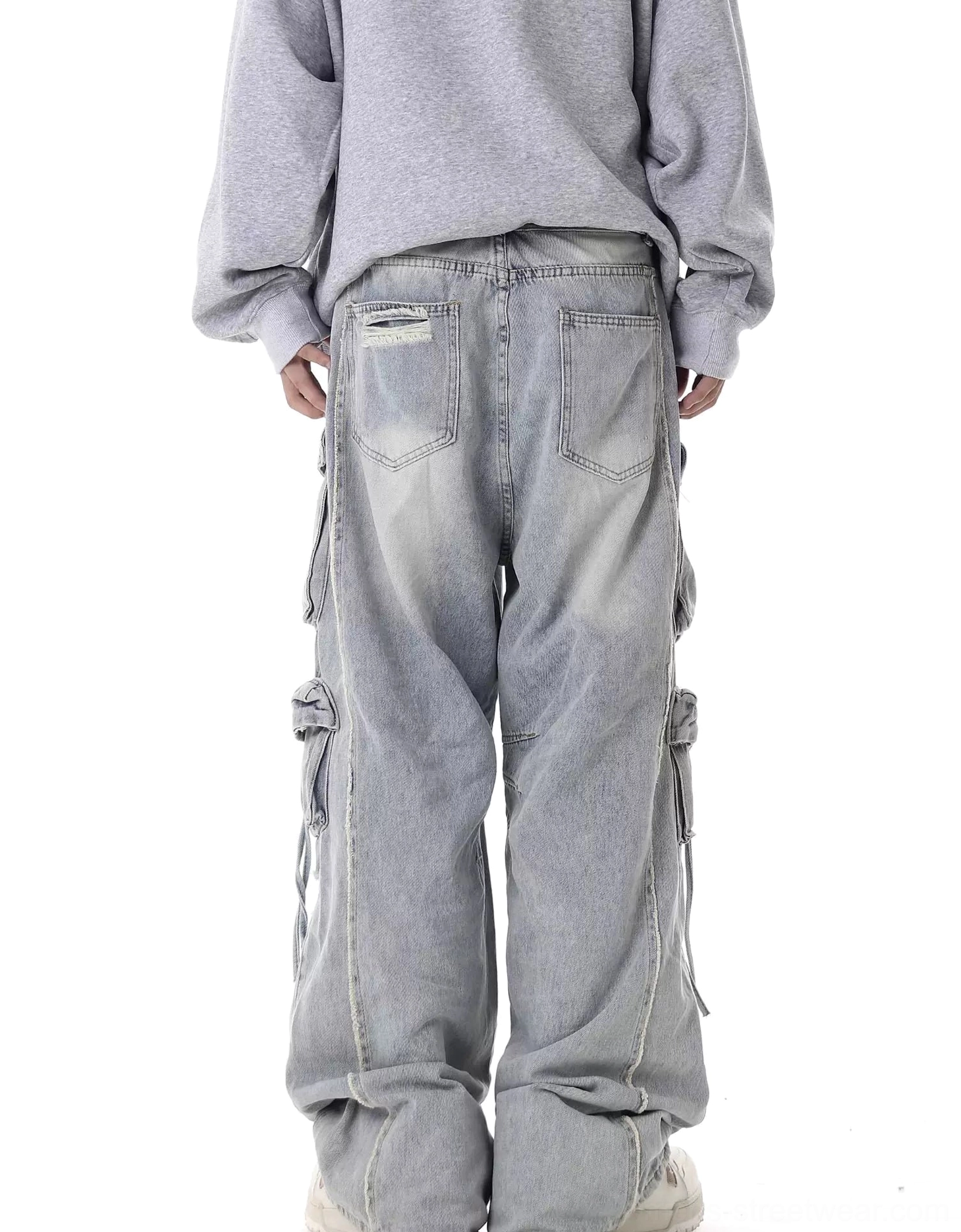 Light blue distressed wide-leg cargo jeans back view with side utility pockets washed denim and oversized fit