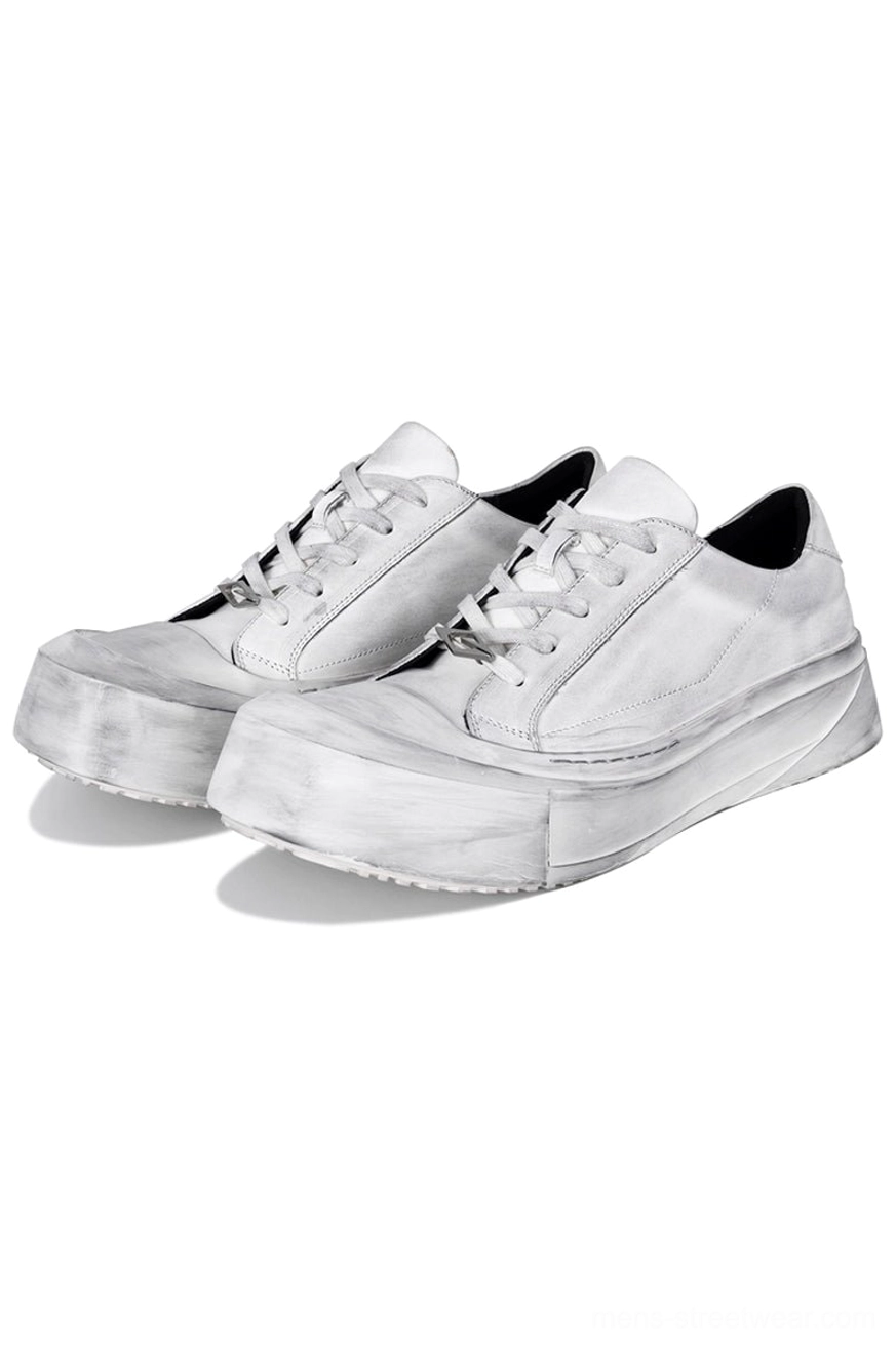 Distressed off-white leather toe cap platform sneakers with weathered finish, lace-up design, and chunky white EVA sole