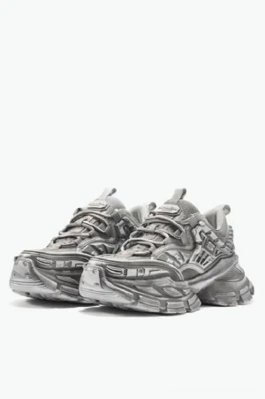 Distressed silver grey mecha platform sneakers pair in front three-quarter view with layered metallic upper and chunky lug sole