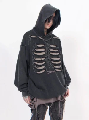 Black distressed skeleton cutout oversized hoodie front left three quarter view with washed fabric and rib cage streetwear graphic