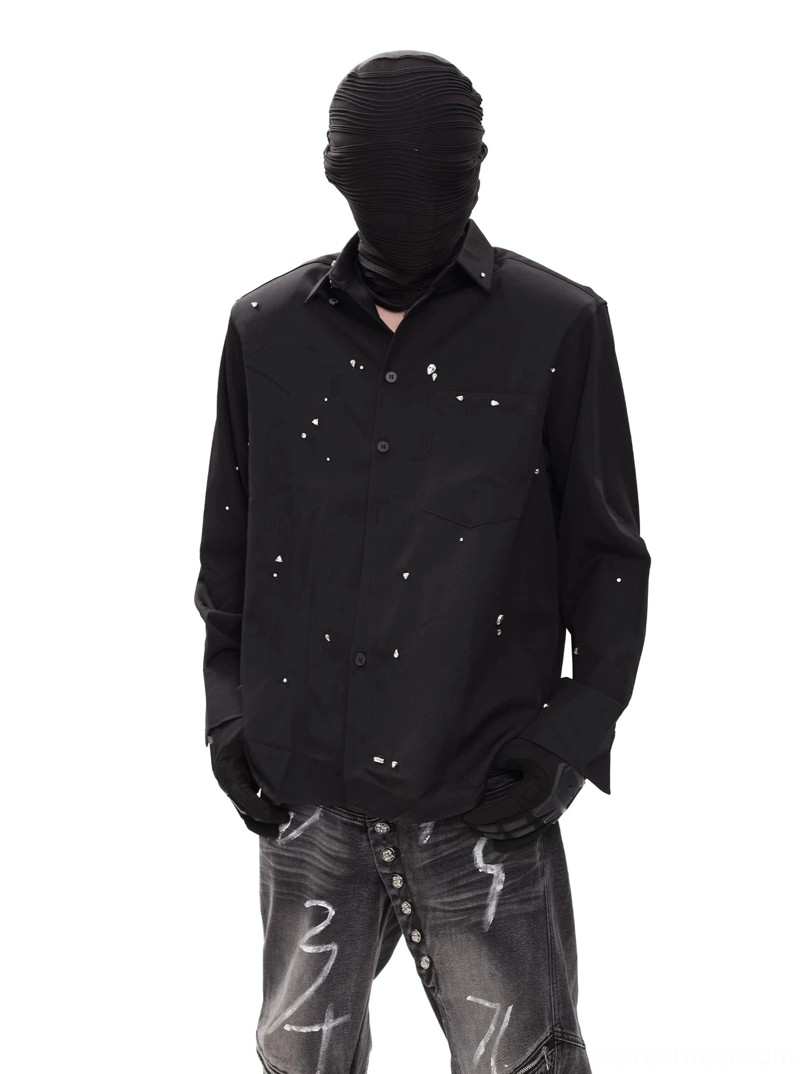 Front view of black speckled long sleeve techwear shirt with relaxed fit, point collar, chest pocket, and scattered white graphic detailing