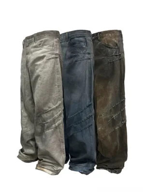 Distressed stacked wide-leg jeans in multiple vintage faded denim washes shown in front flat lay view