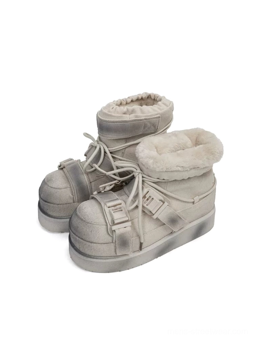 Overhead view of distressed white triple-buckle platform snow boots with padded fleece-lined collar and chunky rubber sole
