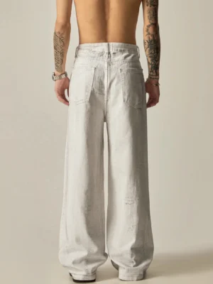 Back view of faded off-white wide-leg distressed denim jeans with classic rear pockets