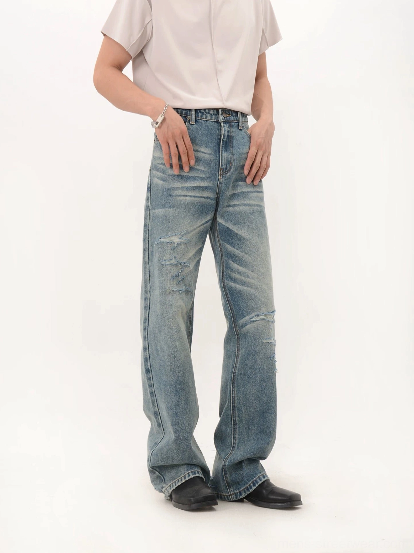 Vintage faded blue wide-leg distressed denim jeans front full-length streetwear fit