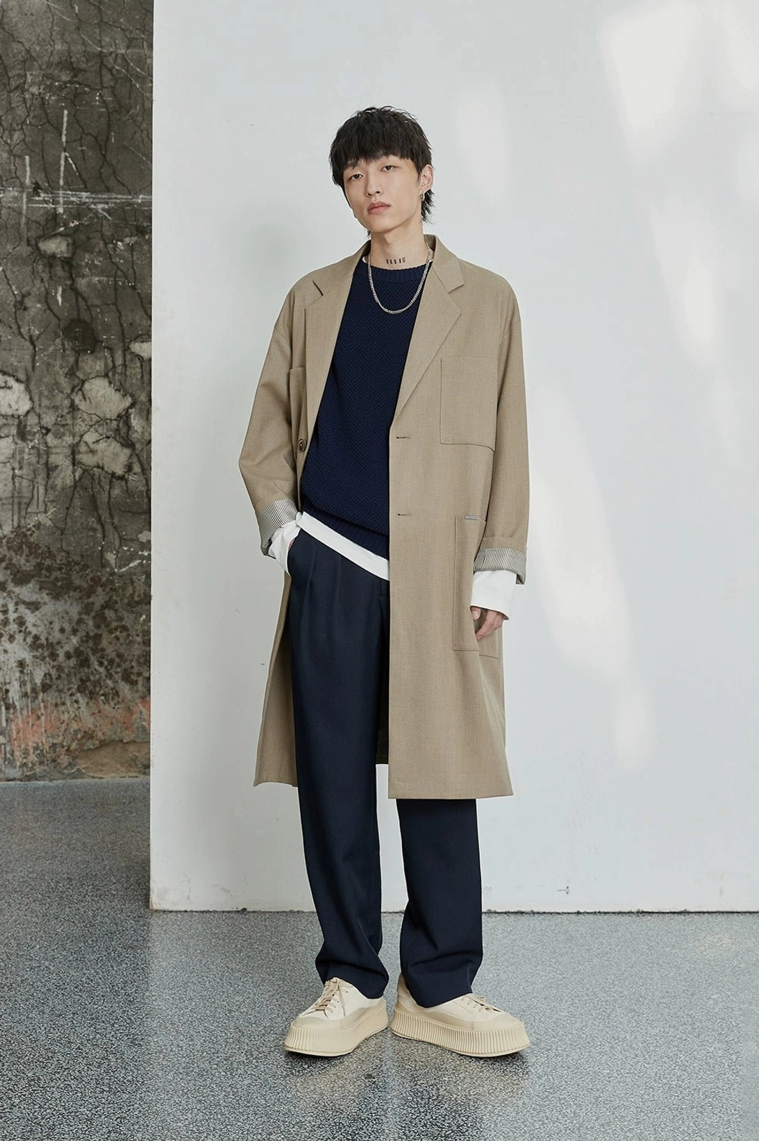 Double-pleated mens trousers with smooth polyester fabric and modern architectural fit