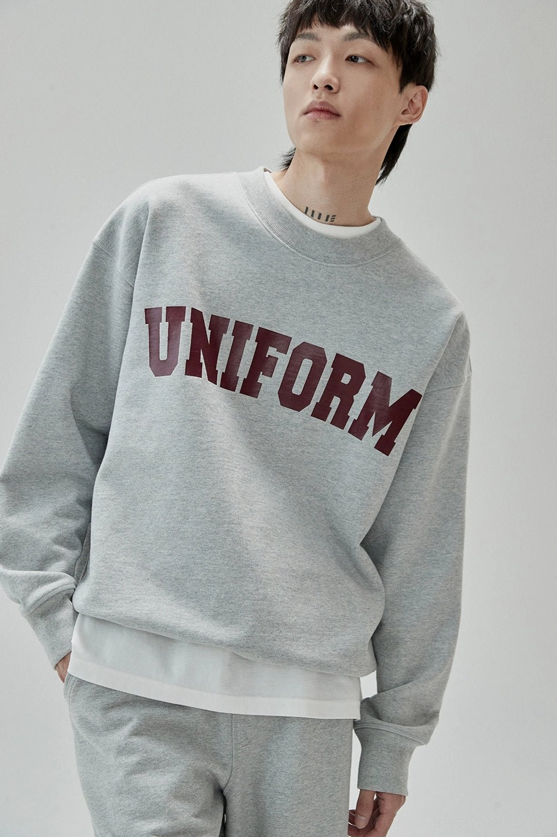 Durable double-stitched UNIFORM graphic sweatshirt with comfortable relaxed streetwear construction
