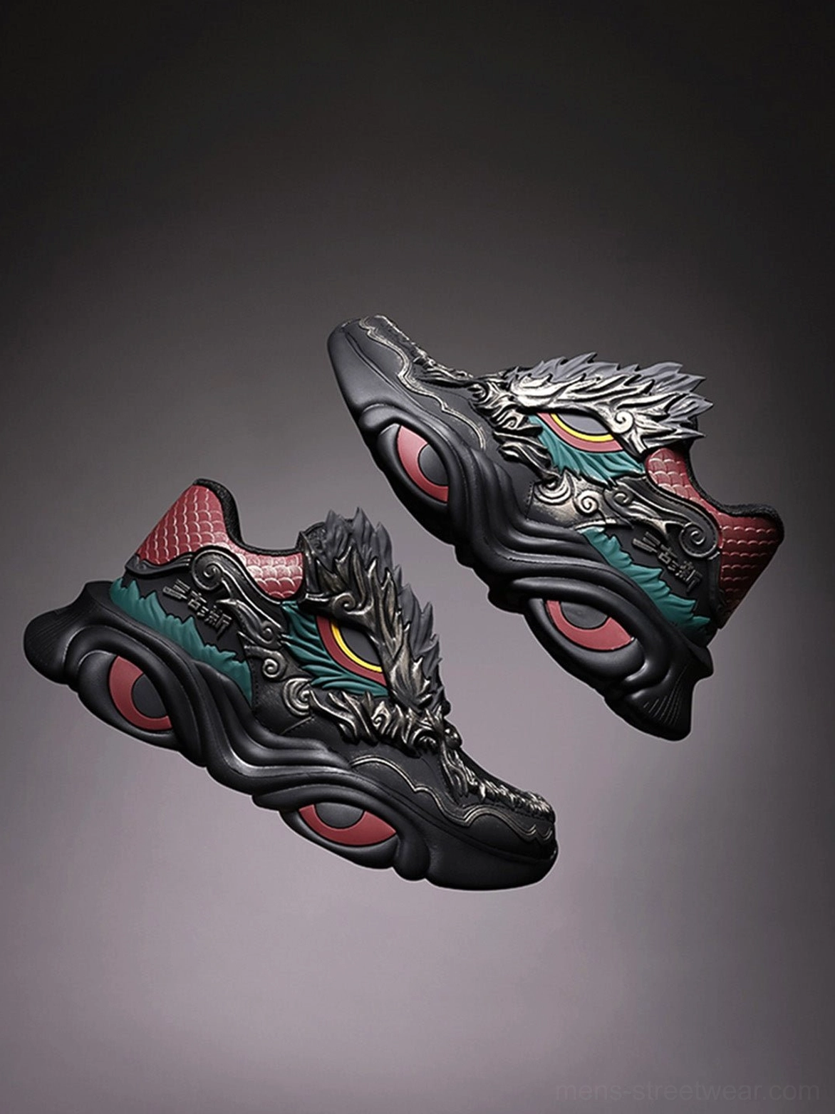Staggered pair of dragon crest chunky runner sneakers showing black layered uppers dragon embroidery and contrast technical soles
