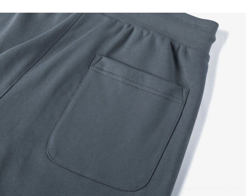 Side profile drawstring sweat shorts flat lay design proportions length measurement side seam detail comprehensive view angle