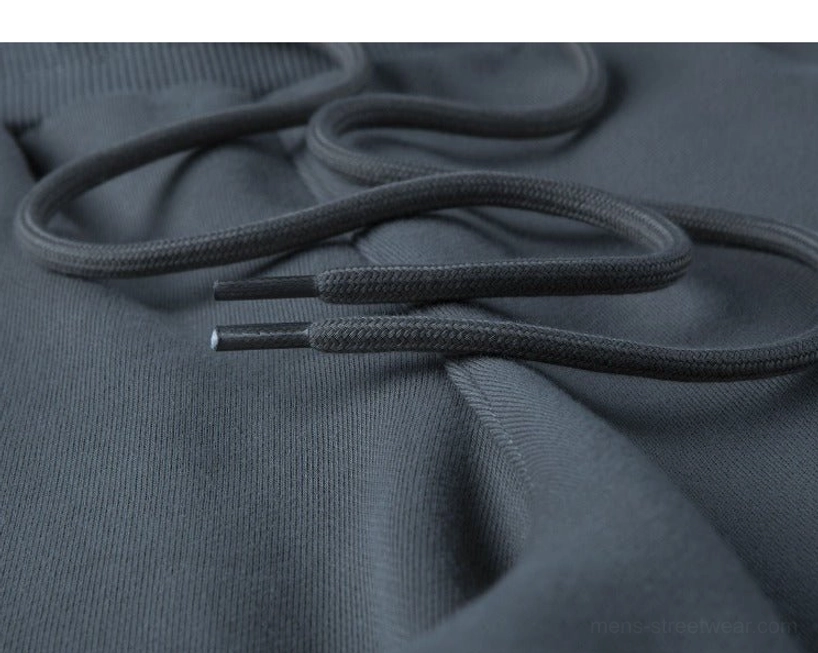 Tag and label detail drawstring sweat shorts care instructions sizing information product authenticity and quality marking