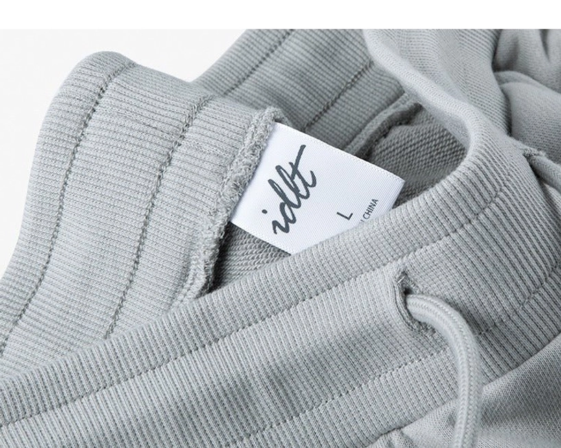 Seasonal wear drawstring sweat shorts spring summer transitional clothing year-round versatility climate appropriate styling options