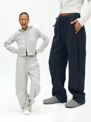 Relaxed loungewear sets with matching drawstring sweatpants and cropped hoodie showing comfortable fit and neutral tones