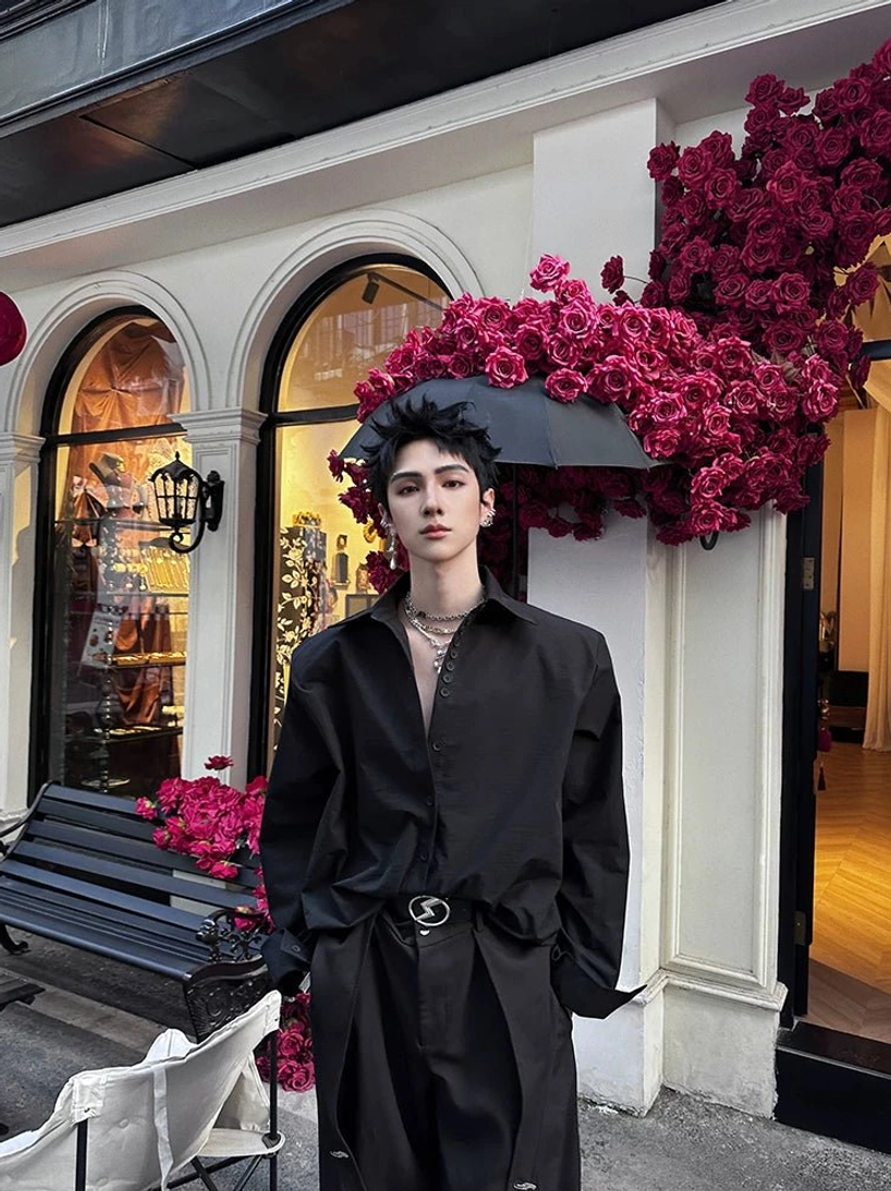 Black oversized button-up cuff shirt styled with a metal buckle waist belt and relaxed Korean fashion fit