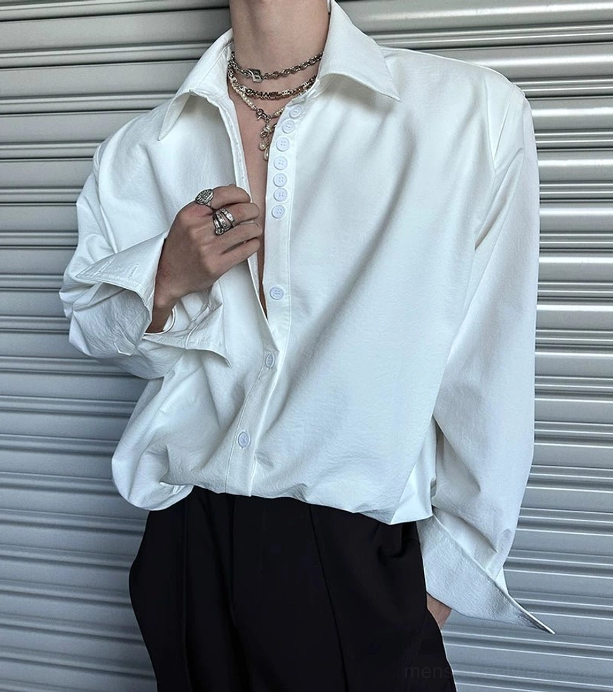 Fashion-forward oversized streetwear shirt with extended cuffs and minimalist button-front design