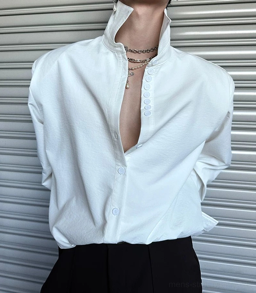 Minimalist oversized button-up shirt with dramatic cuffs and contemporary East Asian streetwear styling