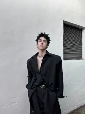 Black oversized cuff shirt with half-open button placket and metal buckle belt in modern streetwear styling