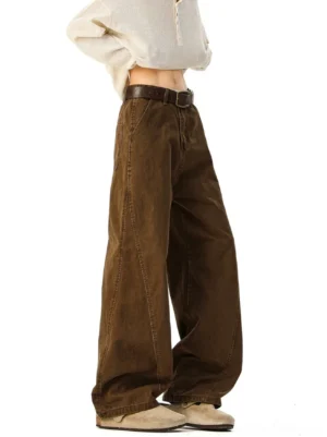 Brown vintage washed ultra-wide denim trousers side view with leather belt, relaxed streetwear silhouette
