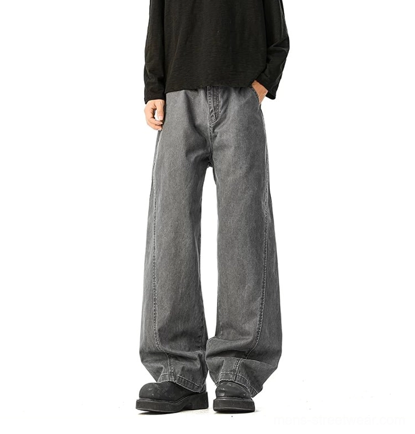 Faded grey wide-leg denim trousers back view showing relaxed fit and pocket details