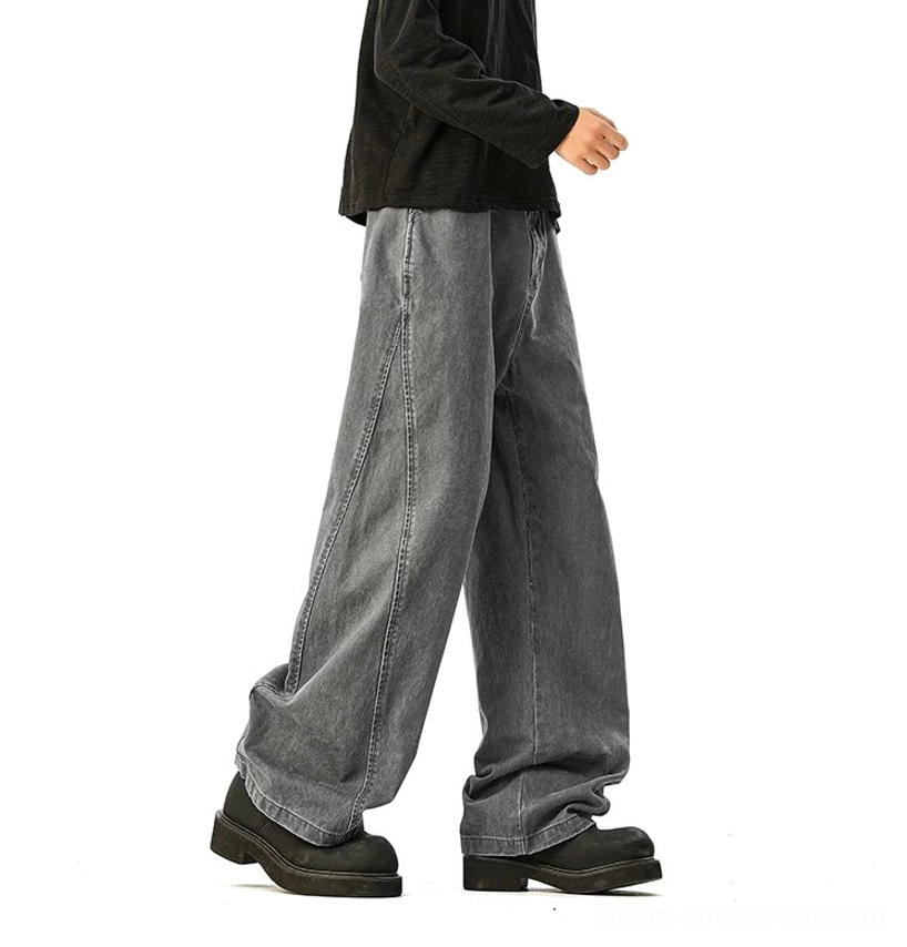 Faded grey wide-leg denim side view standing full-length clean minimalist design